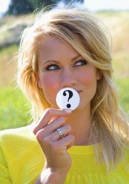 Woman Holding Question Mark